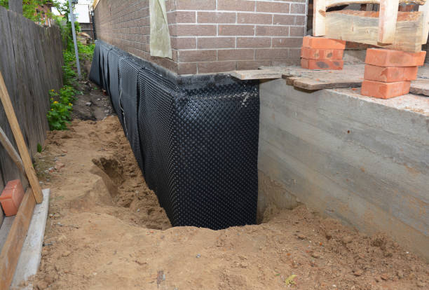 Happy homeowners after waterproofing job in Beech Grove